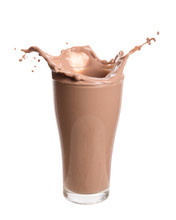 Chocolate Milk Splash Out Of Glass., Isolated On White Background.