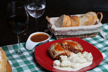 Italian dinner with breads, water and wine, table tidy