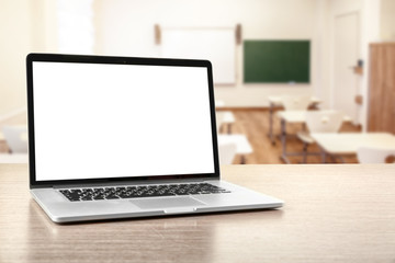 Laptop on wooden desk