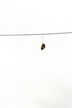 Boots Hanging On Electricty Cable