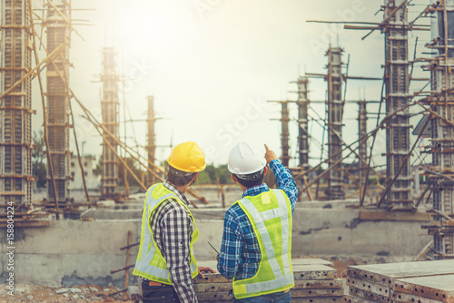 Cuadros en Lienzo Two young man architect on a building construction site
