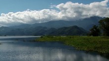 Landscape Of Beautiful Calm Lake Yojoa In Honduras. Mountains On The Background