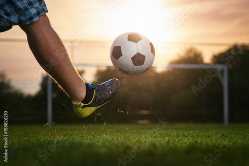Soccer Player Kicking A Ball In To The Goal Sunset In The Background Buy This Stock Photo And Explore Similar Images At Adobe Stock Adobe Stock Soccer Player Kicking A Ball In To The Goal Sunset In The Background Buy This Stock Photo And Explore Similar Images At Adobe Stock Adobe Stock
