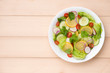 Homemade fresh green vegetable salad on table.