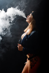 Poster - Beautiful girl vaping from e-cigarette.