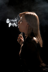 Canvas Print - Beautiful girl vaping from e-cigarette.