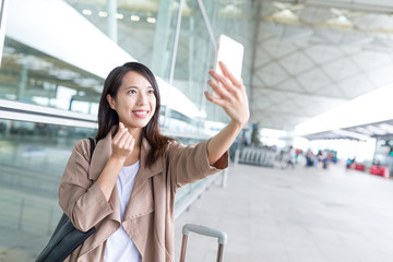 Wall Mural - Woman taking selfie and posing korean haert gesture