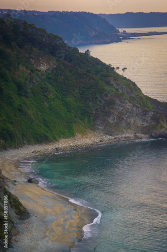 фотография Beautiful beach in the north of Spain, nature of Asturias in warm summer evening