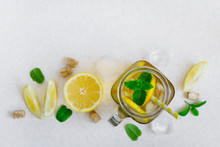 Green Ice Tea With Lemon And Mint In A Glass Jar. Top View With Copy Space