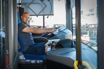 The young men ride a bus, picking up the traveler