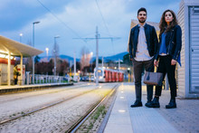Couple Waiting On Tramway Platform, Florence, Italy