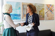 © Connect Images - Female designer greeting female client in office lobby