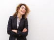 © mimagephotos - business woman smiling against white background looking at copy space