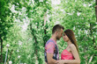© combo1982 - Young couple hugging and smiling at each other in the park