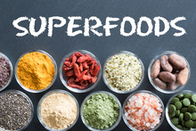 Selection of superfoods on a black background
