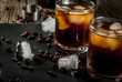 Alcohol. Drinks, Boozy Black Russian cocktail with vodka and coffee liquor on rustic wooden table. copy space