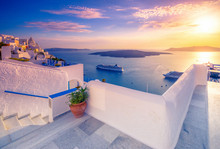 Amazing Evening View Of Fira, Caldera, Volcano Of Santorini, Greece With Cruise Ships At Sunset. Cloudy Dramatic Sky.