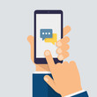 © Succo Design - Message icon on smartphone screen. Hand holds the smartphone and finger touches screen. Modern Flat design illustration.