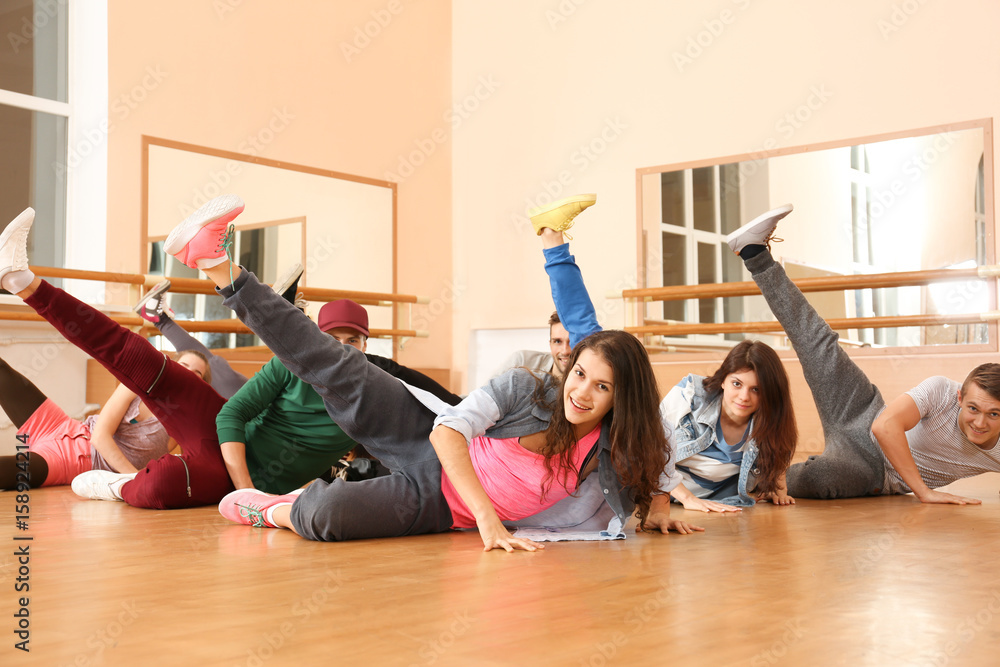 Group of young hip-hop dancers in studio