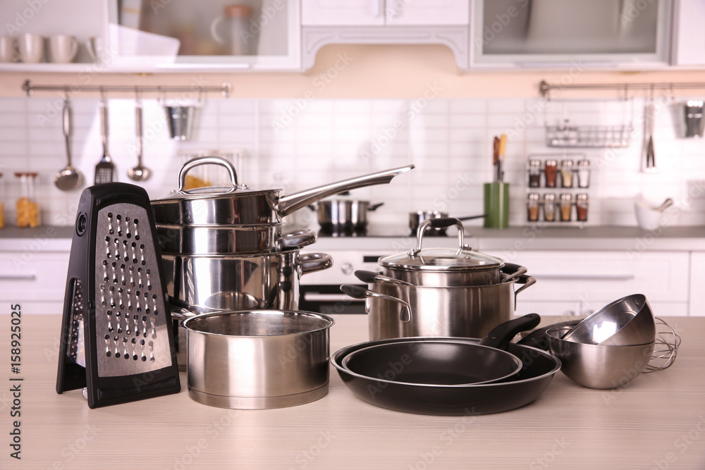 Kitchenware for cooking classes on wooden table