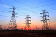 © zhengzaishanchu - The silhouette of high voltage towers