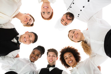 Wall Mural - Happy Restaurant Staff Forming Huddle