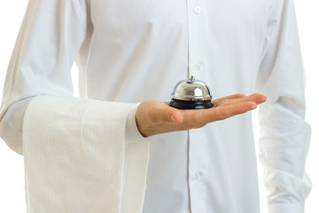 Wall Mural - a close-up portrait of the bells in hand the waiter