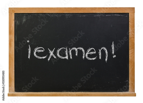 Foto Exam written in Spanish in white chalk on a black chalkboard isolated on white