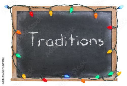 Fotografie, Obraz Traditions written in white chalk on a black chalkboard surrounded with festive