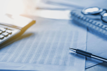 Fototapete - business accounting concept financial with pen and calculator on table work area
