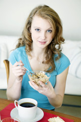 Wall Mural - Woman eating breakfast