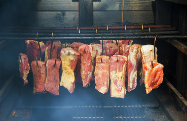 Ham, sausage in a homemade smokehouse