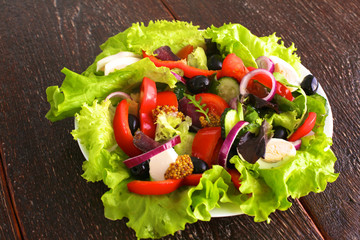 Wall Mural - Fresh vegetables on wooden and blur background