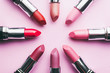 © BONNINSTUDIO/Stocksy - Close up of lipsticks on pink background