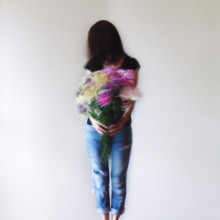 Movement Image Woman Holding A Very Large Bouquet Of Colourful Flowers