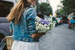 © Jovo Jovanovic/Stocksy - Girl holding a bouquet of wildflowers