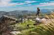 © Micky Wiswedel/Stocksy - Female hiker with a backpack in the mountains in summer