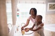© WavebreakMediaMicro - Mother assisting daughter while washing hands in bathroom
