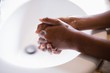 © WavebreakMediaMicro - Cropped image of person washing hands at sink