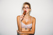 © Studio Firma/Stocksy - Sexy Woman in bra posing with ice-cream