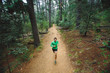 © Micky Wiswedel/Stocksy - Fit active man running a trail through a forest