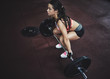 © Lumina/Stocksy - Woman Holding a Weight in the Gym