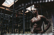 © Rob and Julia Campbell/Stocksy - Young, fit black man recovering after training hard in fitness gym