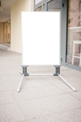 Signboard stand mock up. White banner template in the street