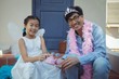 © wavebreak3 - Father and daughter in fairy costume having a tea party
