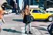 © Good Vibrations Images/Stocksy - Attractive woman walking in New York City