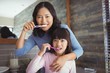 © WavebreakMediaMicro - Mother and daughter brushing teeth in the bathroom