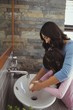 © WavebreakMediaMicro - Mother and daughter washing hands in bathroom sink