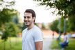 © Alvin Harambašić - Young handsome guy in park standign and smiling