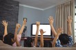 © WavebreakMediaMicro - Family watching television together in living room